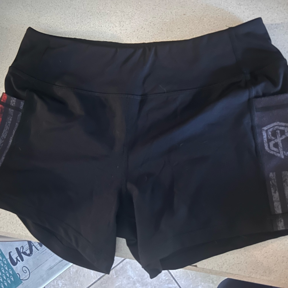 Size medium, thin red line BP shorts. 2.5 in. inseam w/ side pockets.